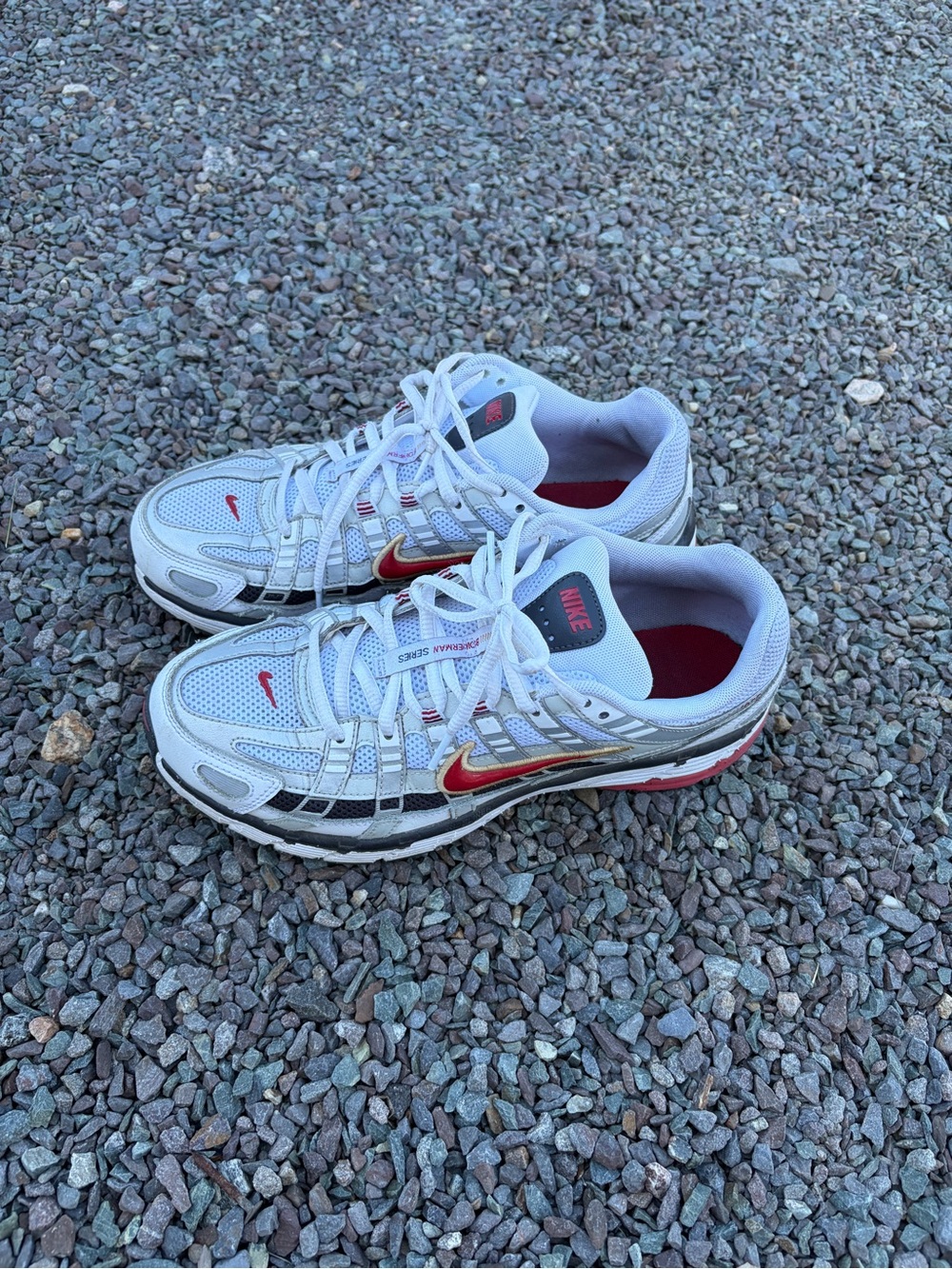 Nike White Sneakers with Red and Gold Swoosh